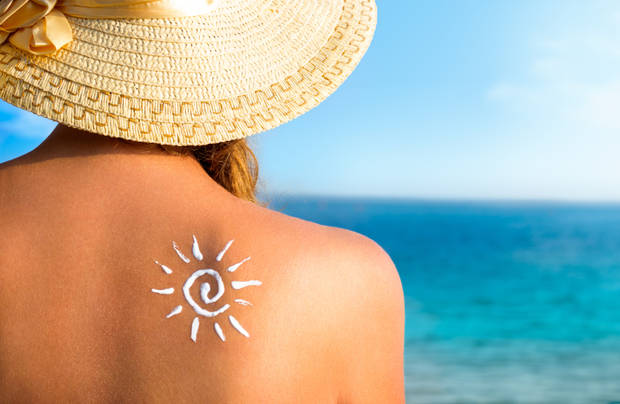 girl using sunscreen to safe her skin healthy, sun tanning, skin care and protection, vacation