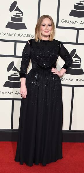 Singer Adele arrives on the red carpet during the 58th Annual Grammy Music Awards in Los Angeles February 15, 2016. AFP PHOTO/ Valerie MACON / AFP / VALERIE MACON (Photo credit should read VALERIE MACON/AFP/Getty Images)