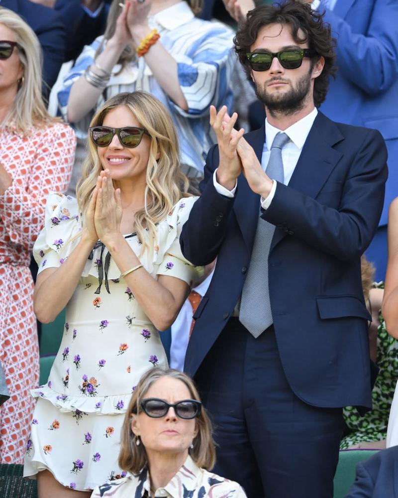 Sienna Miller wears Alessandra Rich Spring Summer 2025 rose print mini dress at Wimbledon