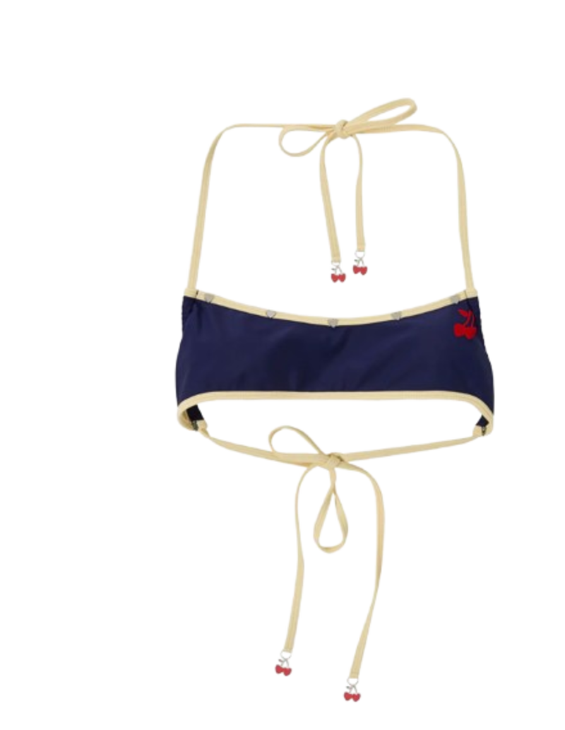 Top micro bikini azul marino de Nude Project con detalles metálicos y estética noventera.