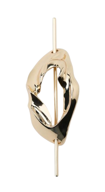 Pasador metálico ovalado de Zara en acabado dorado, con diseño en relieve y cierre de varilla, ideal para decorar un recogido